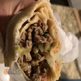 Inside of Carne Asada Burrito - was tasty and juicy. Would order again!