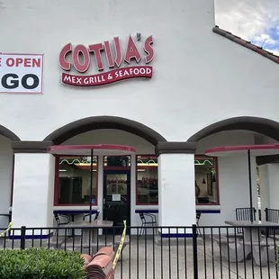 Outside: view of outdoor dining area from drive thru