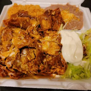 Chilaquiles! Yum Covered in a sort of mole sauce.