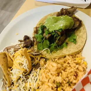 Carnitas taco with rice and beans