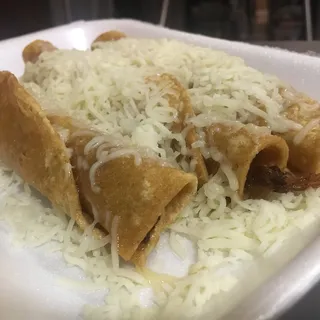 3 Rolled Tacos with Cheese and Guacamole