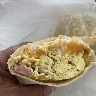 This is supposed to be a breakfast burrito with eggs potatoes and ham. &quot;No Potatoes&quot; and one piece of ham.