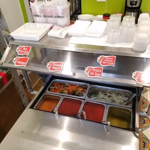 Salsa bar with carrots and onions