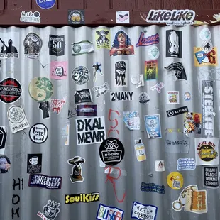 a lot of stickers on a wall