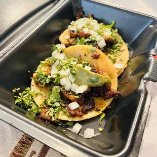 two tacos on a tray