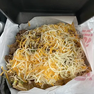 Nachos supreme.  I couldn&apos;t wait and ate some.  It was a perfect blanket of cheese!!