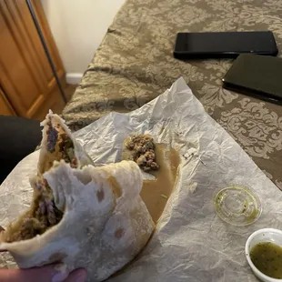 Carne asada burrito with pieces of a metal scrubbing pad inside...