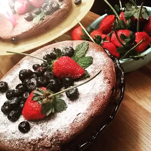 Decadent flourless chocolate cake with fresh berries.