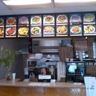 a restaurant counter and menus