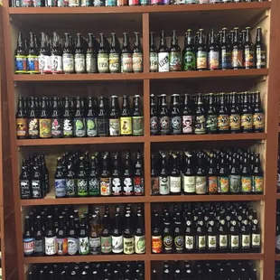 a shelf full of beer bottles