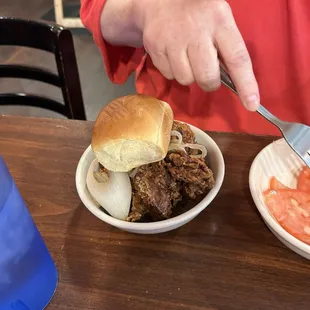 Chicken livers, she said the onions were a little undercooked and lackluster dinner roll