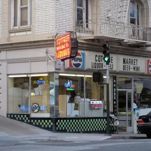 a car driving past a cafe