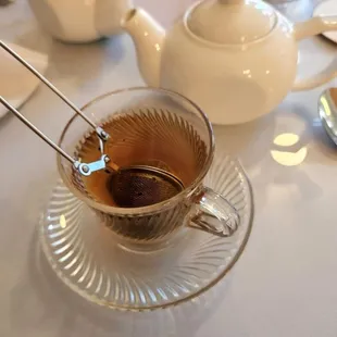 a cup of tea with a spoon in it