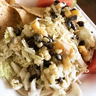 Pork Tenderloin Tacos with cabbage slaw and mango, black beans, and fresh corn salsa. (Gluten Free!)