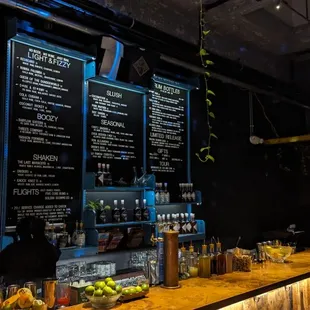 a bar with a menu on the wall