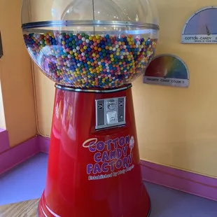 Bubblegum machine in the front window of the store.