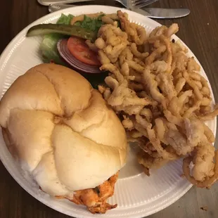 The buffalo chicken sandwich with onion strings.
