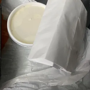 Cream gravy and bag with rolls