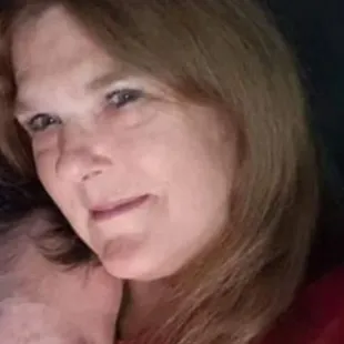 a woman holding a baby