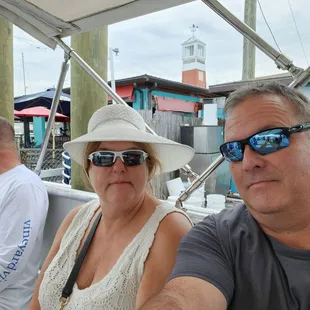 a man and a woman on a boat