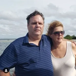 a man and woman on a boat
