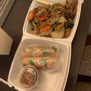 a tray of food and a laptop