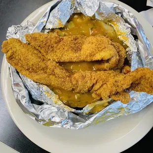Baked potato with catfish and crawfish etoufee