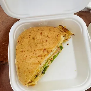 a sandwich in a styrofoam container