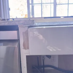 The sink is leaning forward and caused stress on the sink. This is pre caulking but the caulking was around 3/4 inches thick in the front