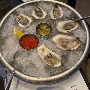 a platter of oysters on ice