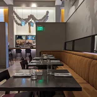 a dining area with tables and chairs