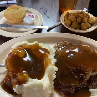 a plate of mashed potatoes and gravy