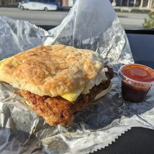 Tenderloin egg and cheese biscuit is not complete without some of the house hot sauce!