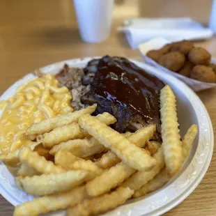 a plate of french fries and meat