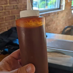 Bottles of the hot sauce available for dine in, make liberal use of it.