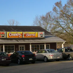 cars parked in front of a restaurant