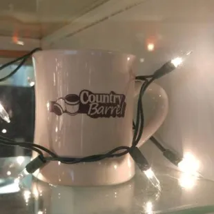 a coffee mug with a string of lights