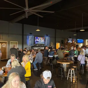 a large group of people sitting at tables