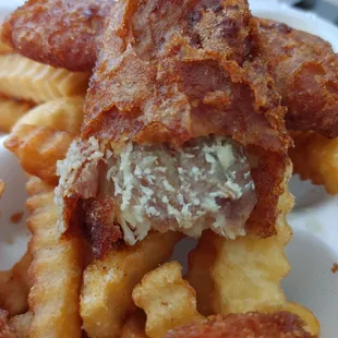 Inside of the fried fish.. super old and nasty white stuff inside