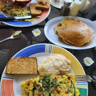 two plates of breakfast food