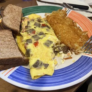 Giro's omelette with feta cheese, also hashbrowns cooked to perfection and toast