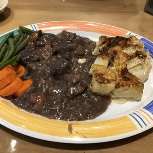 Beef Burgundy with scalloped potatoes and veggies. A delicious daily special.
