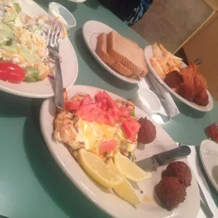 Smothered chicken with hush puppies! Delicious