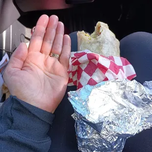 Breakfast burrito with egg, potatoes, bacon and cheese