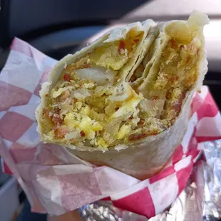 Breakfast burrito with egg, potato, bacon and cheese