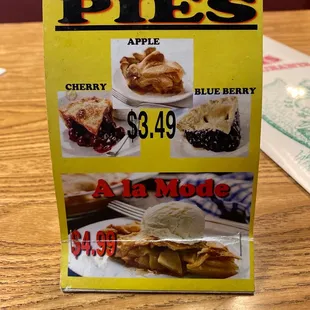 a menu for pies on a table