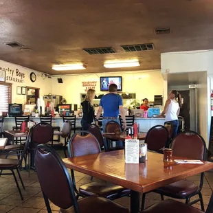 a restaurant with tables and chairs