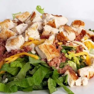 Fresh cut lettuce Fresh cut tomatoes Fresh chicken breast  Great salad with cheese and bacon as well