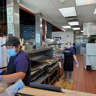 two workers in a kitchen