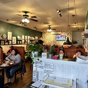 people sitting at tables eating